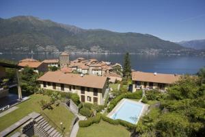 an aerial view of a house with a swimming pool at Residenz La Fonte Studios in Pino Lago Maggiore