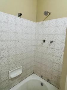 a bathroom with a toilet and a shower and a tub at Executive Guesthouse in Vereeniging +18 photos