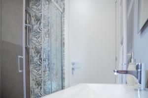 a shower curtain in a bathroom with a sink at Aretium in Arezzo