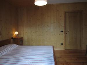Кровать или кровати в номере Appartamento Serdes Big C2