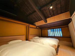 Lova arba lovos apgyvendinimo įstaigoje NIPPONIA HOTEL 伊賀上野 城下町