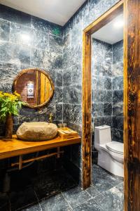 a bathroom with a sink and a mirror at Sapa Riverside Homestay in Sa Pa