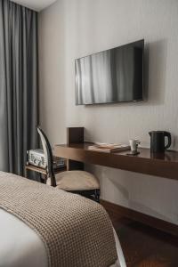 TV a/nebo společenská místnost v ubytování Welcome Hotel