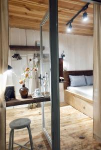 Postel nebo postele na pokoji v ubytování Di House Đà Lạt