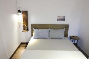 Postel nebo postele na pokoji v ubytování Di House Đà Lạt