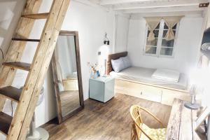 Postel nebo postele na pokoji v ubytování Di House Đà Lạt