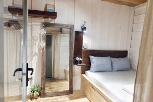 Postel nebo postele na pokoji v ubytování Di House Đà Lạt