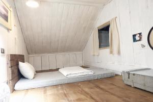 Postel nebo postele na pokoji v ubytování Di House Đà Lạt