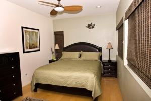 a bedroom with a bed and a ceiling fan at Slopes_loft in Brian Head