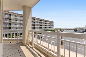 a balcony with a view of a building at Residence 102 At The Grand in Wildwood