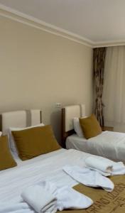 Posteľ alebo postele v izbe v ubytovaní Doğa Suite Hotel