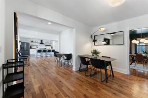 a living room and dining room with a table and chairs at 109 W Magnolia Ave in Wildwood