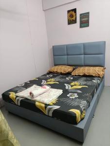 Postel nebo postele na pokoji v ubytování Homestay Budget Alor Setar