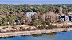an aerial view of a building next to a river at Apartamenty In Mestwina 37 Jurata in Jurata