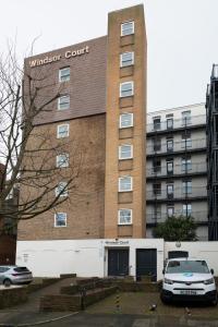 a building with a car parked in front of it at Stunning studio flat in the heart of Brighton in Brighton & Hove