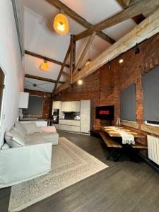 a large room with a bed and a desk in it at Industrial Escape -Kelham Island in Sheffield