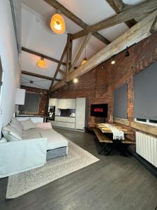 a large room with a bed and a tv at Industrial Escape -Kelham Island in Sheffield