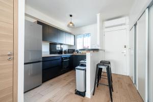 Appartement Le Marly - Happy Rentals tesisinde mutfak veya mini mutfak