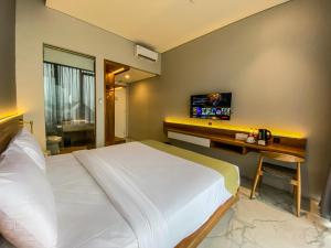 Krevet ili kreveti u jedinici u okviru objekta Facade Hotel by Azana