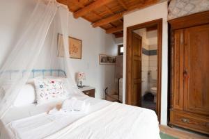 Posteľ alebo postele v izbe v ubytovaní Cretan Magnolia Gem - Smari Cozy Getaway