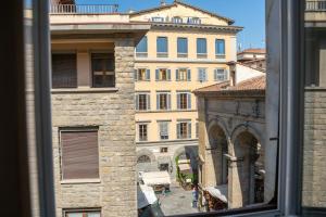 a view of a building from a window at Residenza degli Speziali in Florence