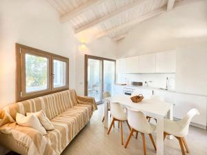 a living room with a couch and a table at La Residenza del Mare in Limpiddu +19 photos