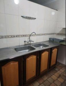 a kitchen with a sink and a counter at OR Tambo Int Airport Rudman B Self Catering Two Bedroom Home in Boksburg