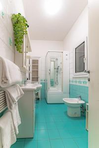 a bathroom with two sinks and a shower and a tub at Marta Suite - Metro Malatesta in Rome