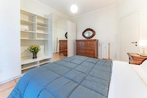 a bedroom with a large bed and a dresser at Marta Suite - Metro Malatesta in Rome