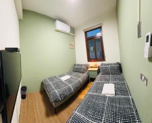Letto o letti in una camera di Liu Xu Homestay ll