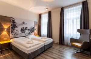 Postel nebo postele na pokoji v ubytování Hotel Westbahn