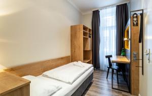 Postel nebo postele na pokoji v ubytování Hotel Westbahn