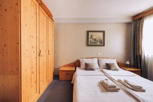 A bed or beds in a room at Martinov Hram Bovec