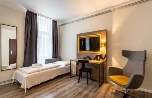 Postel nebo postele na pokoji v ubytování Hotel Westbahn