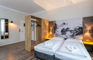 Postel nebo postele na pokoji v ubytování Hotel Westbahn