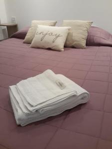 Llit o llits en una habitació de Departamento Alcázar