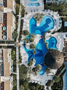 an aerial view of a resort with a swimming pool at Prinsotel La Dorada - 4* Sup in Playa de Muro