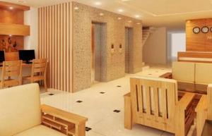 a living room with wooden furniture and a dining room at Siren Flower Hotel in Nha Trang