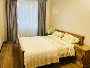 Postel nebo postele na pokoji v ubytování Eco Apartments Melnyka10