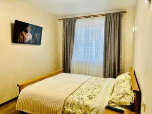 Postel nebo postele na pokoji v ubytování Eco Apartments Melnyka10