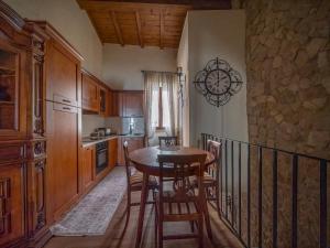 a kitchen with a table and chairs in a room at Suite Contessa Isabella in Bracciano