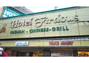 a building with a sign for a chinese restaurant at Spacious Flat - Centrally Located in Hyderabad