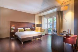 Postel nebo postele na pokoji v ubytování Golden Tulip Ampt van Nijkerk