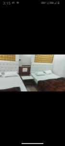 a picture of a room with benches and tables at Hotel New Food Restrorent in Ujjain
