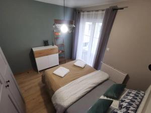 Ένα ή περισσότερα κρεβάτια σε δωμάτιο στο Loft przy Wiśniowej