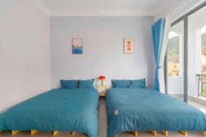 Postel nebo postele na pokoji v ubytování Kim Little Hotel Dalat