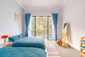 Postel nebo postele na pokoji v ubytování Kim Little Hotel Dalat