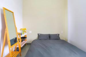 Postel nebo postele na pokoji v ubytování Kim Little Hotel Dalat