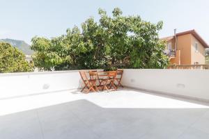 two chairs on the roof of a house at Appartamento Perla Bianca, con WiFi e Air Con in Cala Gonone
