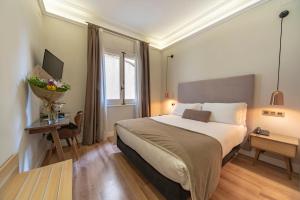 Posteľ alebo postele v izbe v ubytovaní Hotel Real Segovia by Recordis Hotels